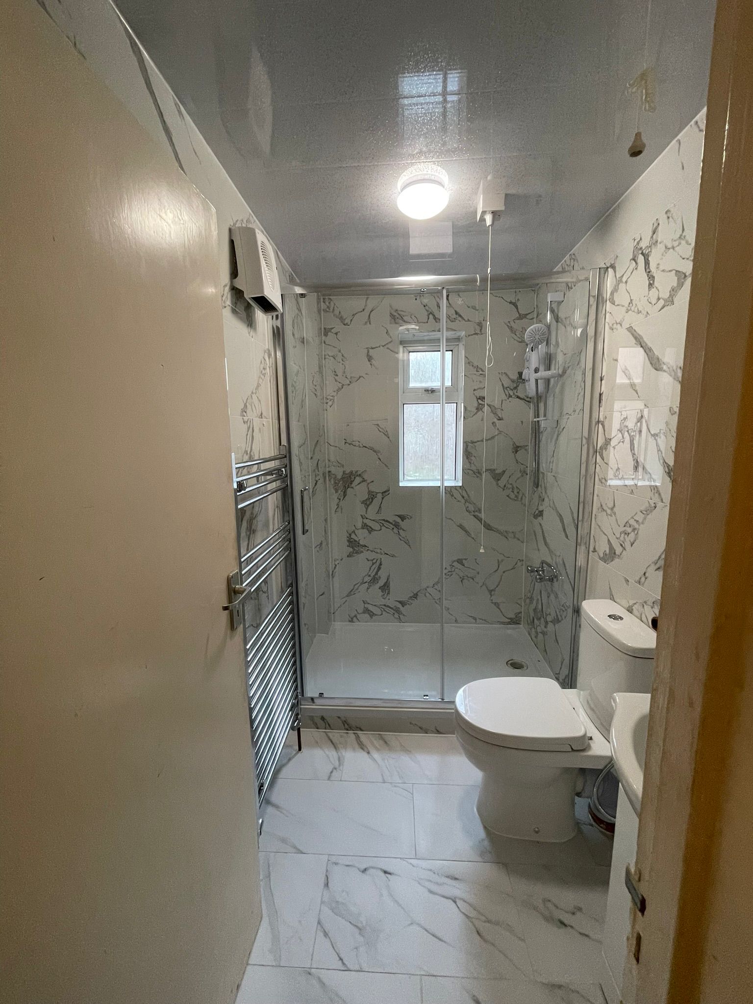 Contemporary bathroom with marble tiling